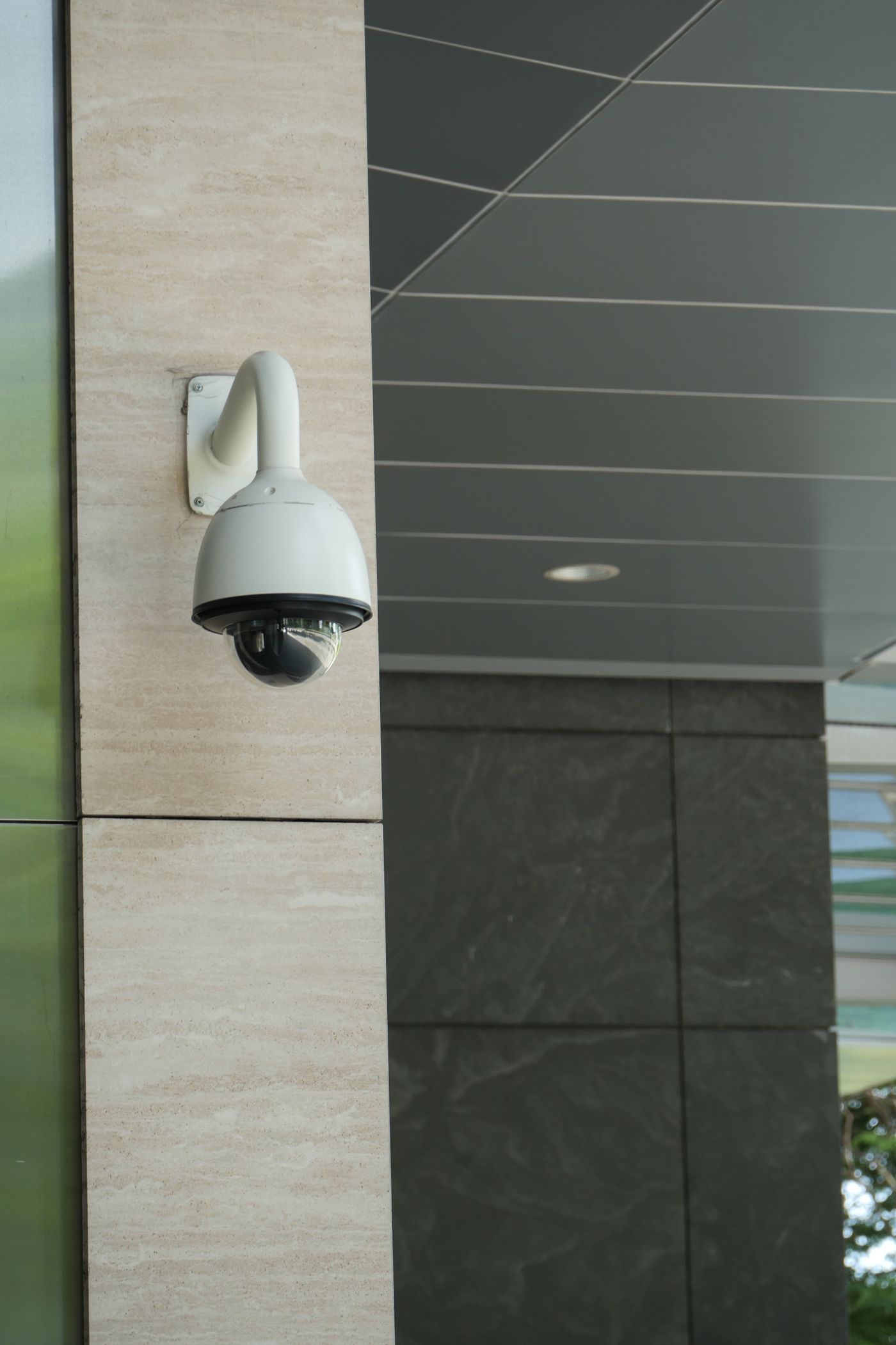 Dome security camera mounted on a commercial building